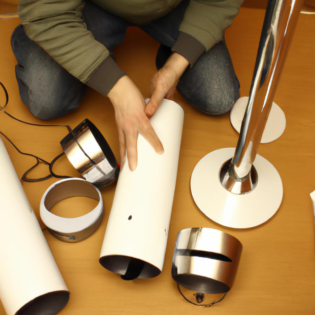 Person assembling floor lamp parts