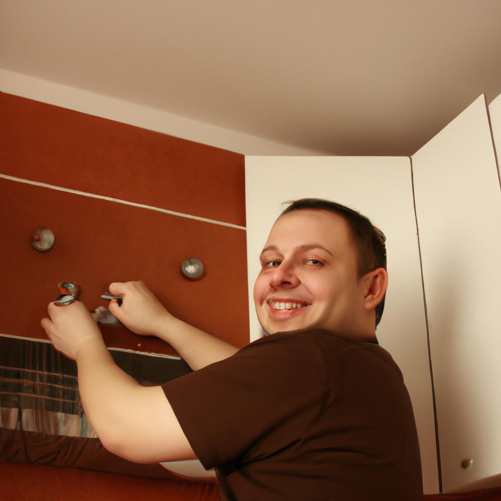 Person installing cabinet knobs, smiling