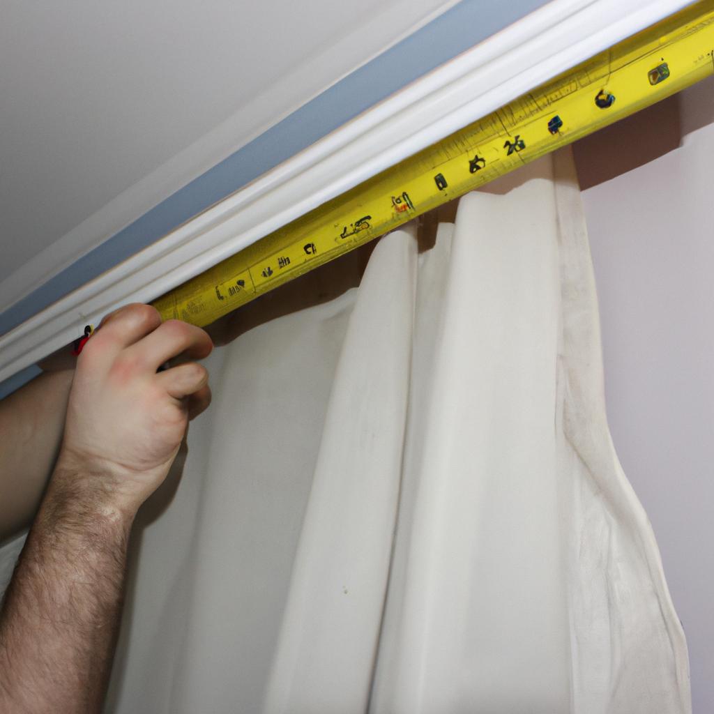 Person measuring and installing valances