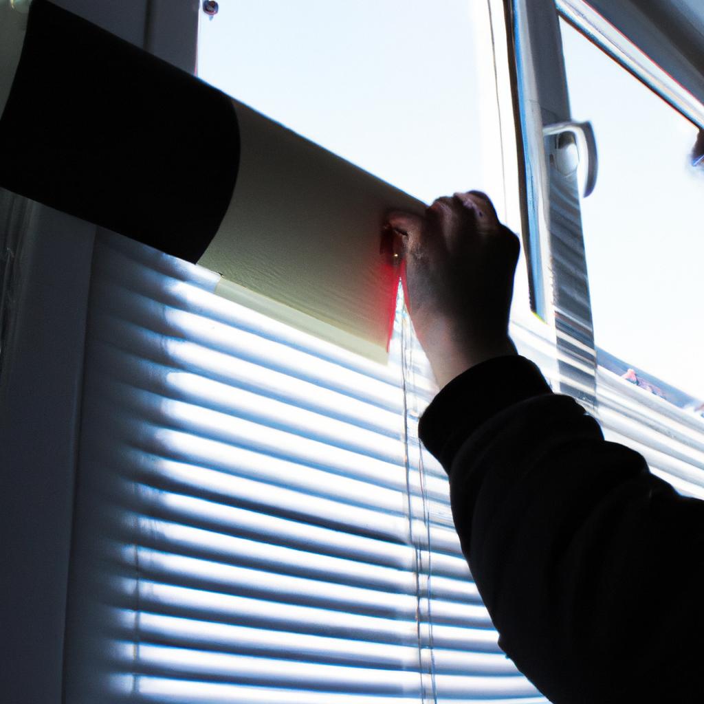 Person applying film to window